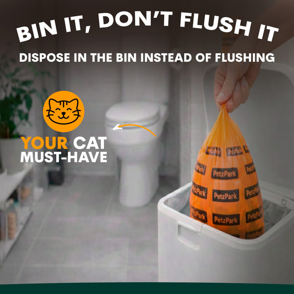 Orange poop bags for cats with text 'BIN IT, DON'T FLUSH IT' in a bathroom setting.