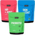 Three stand-up pouches of Petz Park dog supplements on a plain white background: a pink Hip + Joint pouch, a blue Skin + Coat pouch, and a green Probiotic pouch in front.