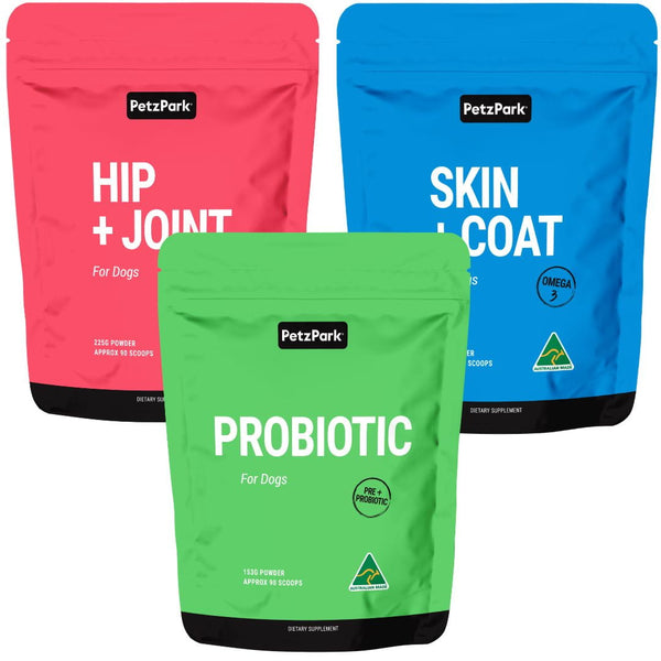 Three stand-up pouches of Petz Park dog supplements on a plain white background: a pink Hip + Joint pouch, a blue Skin + Coat pouch, and a green Probiotic pouch in front.