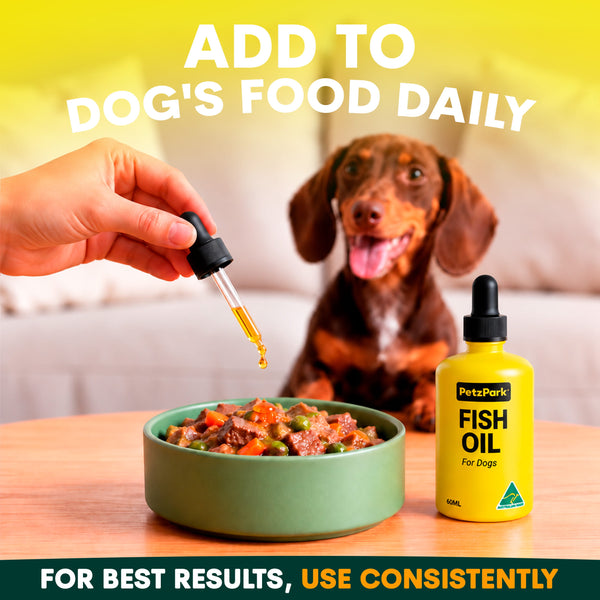 Hand adding Petz Park Fish Oil for Dogs from the dropper to a dachshund's food bowl